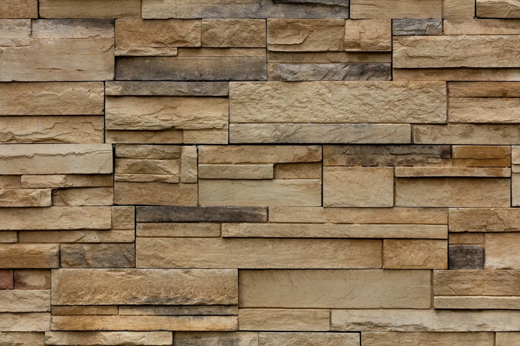 Warm brown brick facade with tight joints by MCG Top Masonry