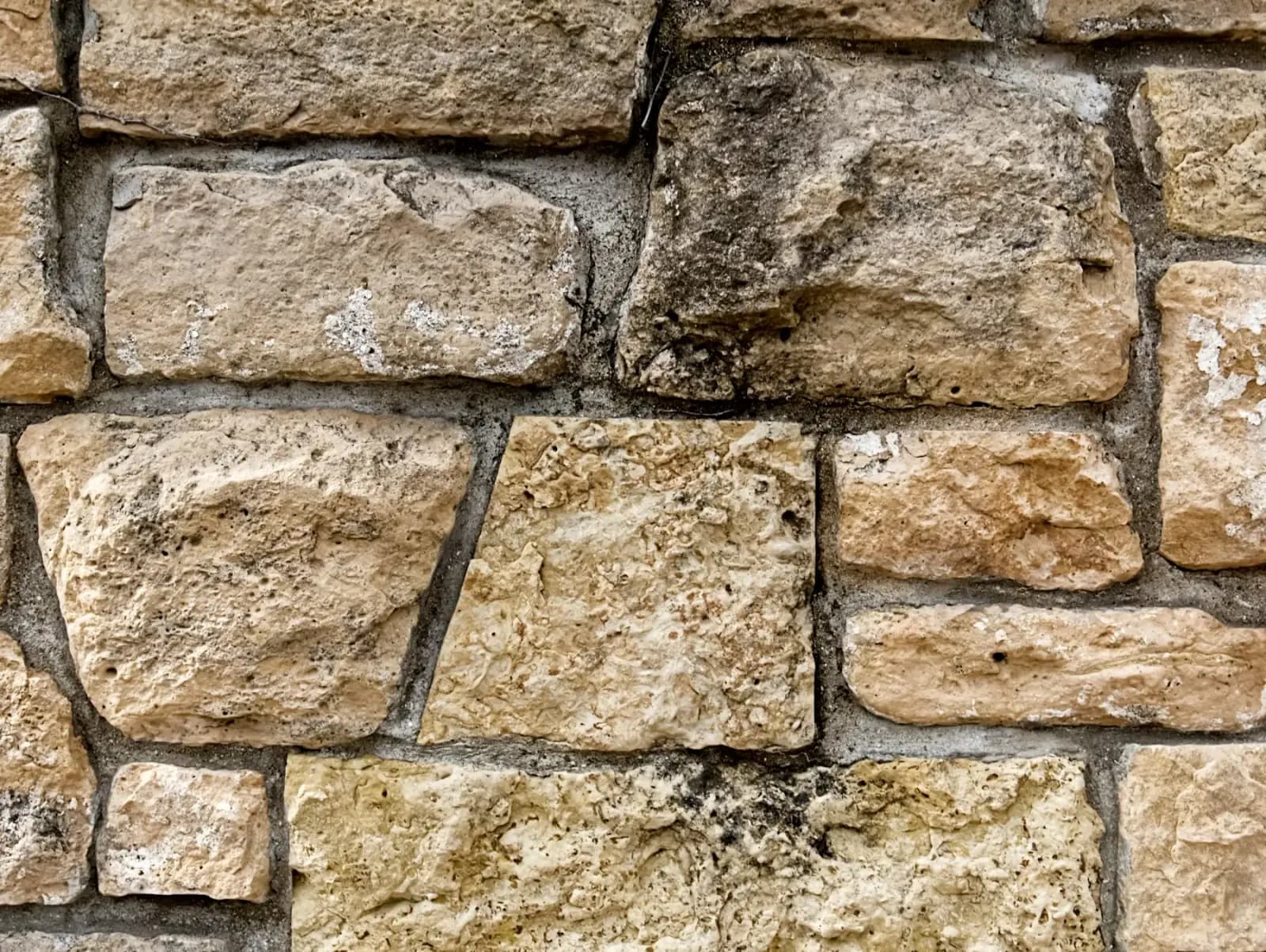 Close-up of natural rock stone wall detail restored by MCG Top Masonry