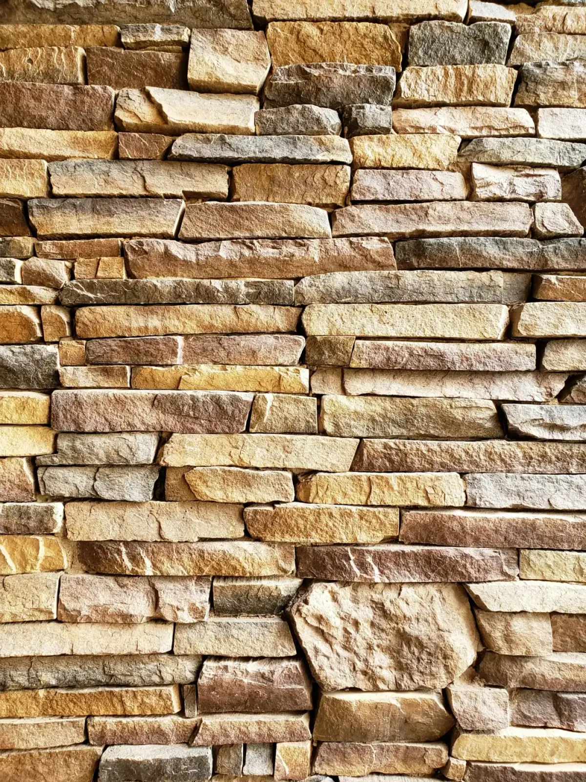 Warm brown natural stone facade installed by MCG Top Masonry in Southern California